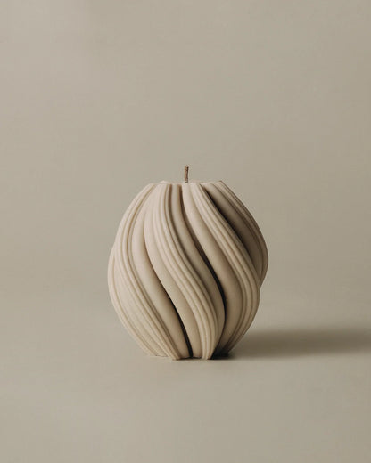 LAWA Candles Swirl Candle, medium, in Sandstone soy wax featuring spiraling twisted ridges, product photo on a plain background