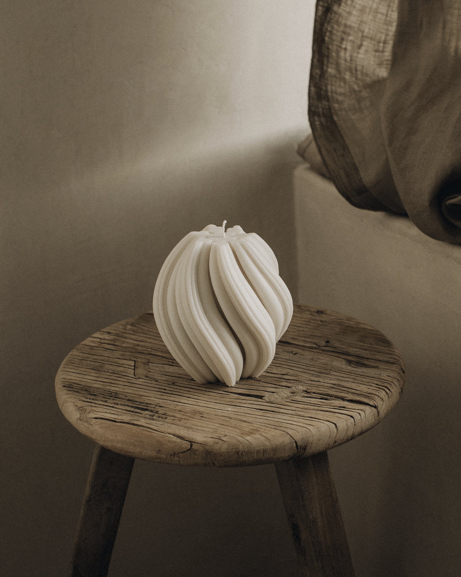 LAWA Candles Swirl Candle, medium, in White soy wax styled in a home decor setting