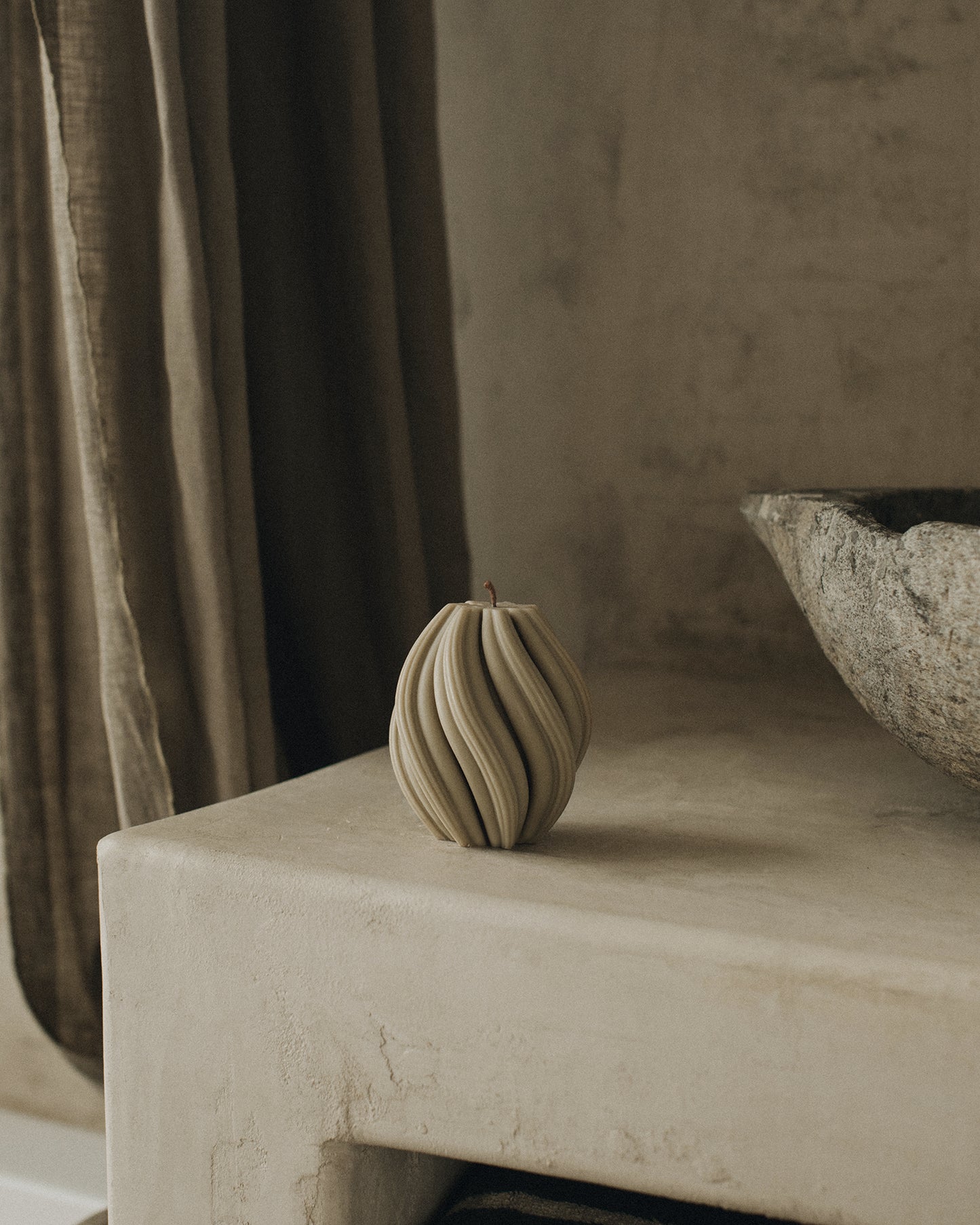 LAWA Candles Swirl Candle, small, in Olive Beige soy wax styled in a home decor setting, alternate angle