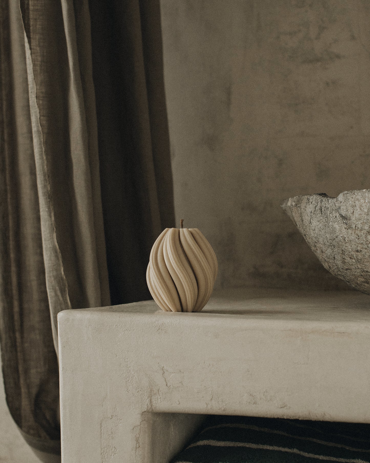LAWA Candles Swirl Candle, small, in Sandstone soy wax styled in a home decor setting