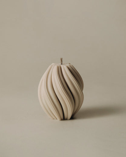 LAWA Candles Swirl Candle, small, in Sandstone soy wax with spiraling twisted ridges, product photo on a plain background