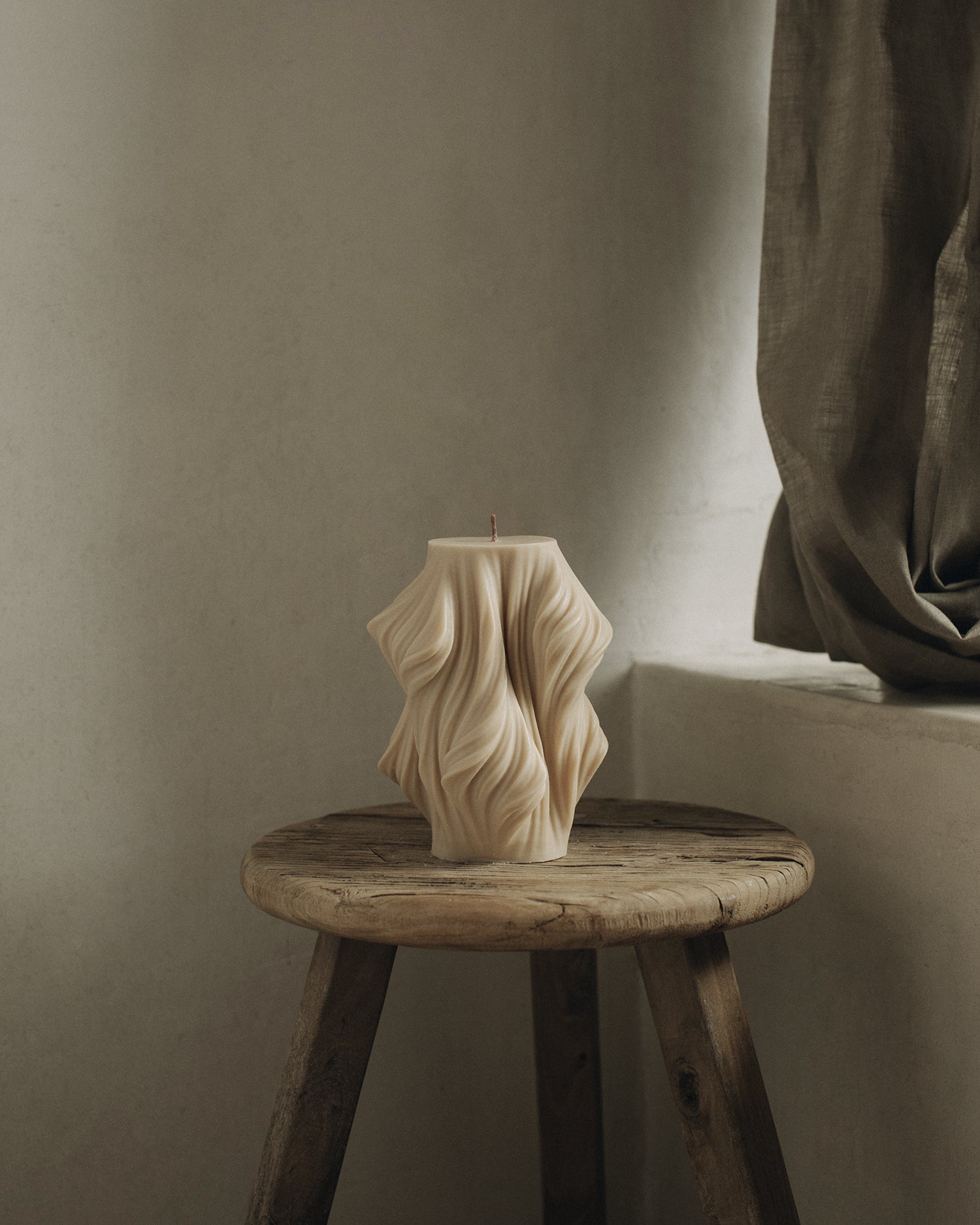 LAWA Candles Cascading Wave Candle, large, in Sandstone soy wax styled in a home decor setting