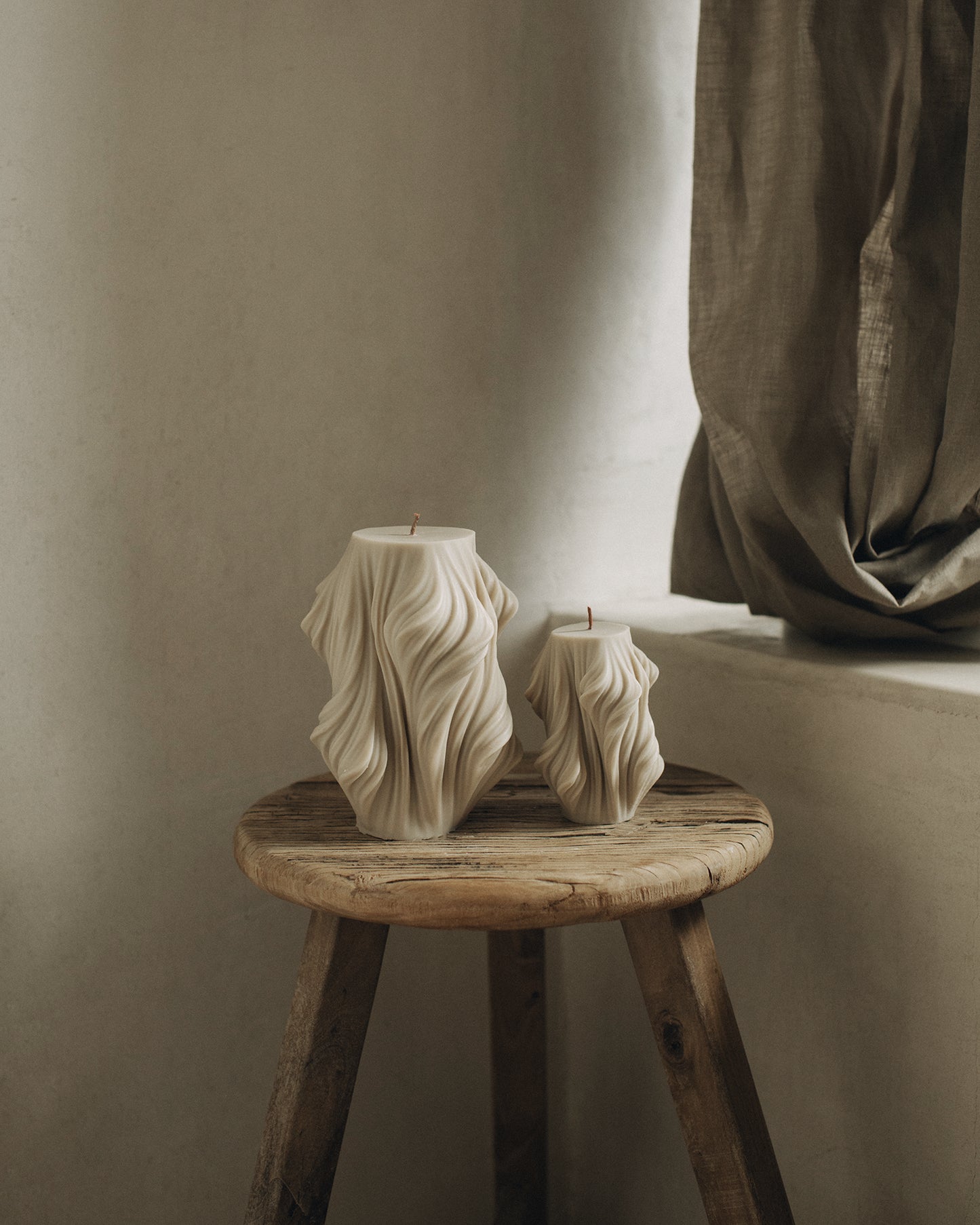 LAWA Candles Cascading Wave Candle, set of 2, in Moon Gray soy wax styled in a home decor setting