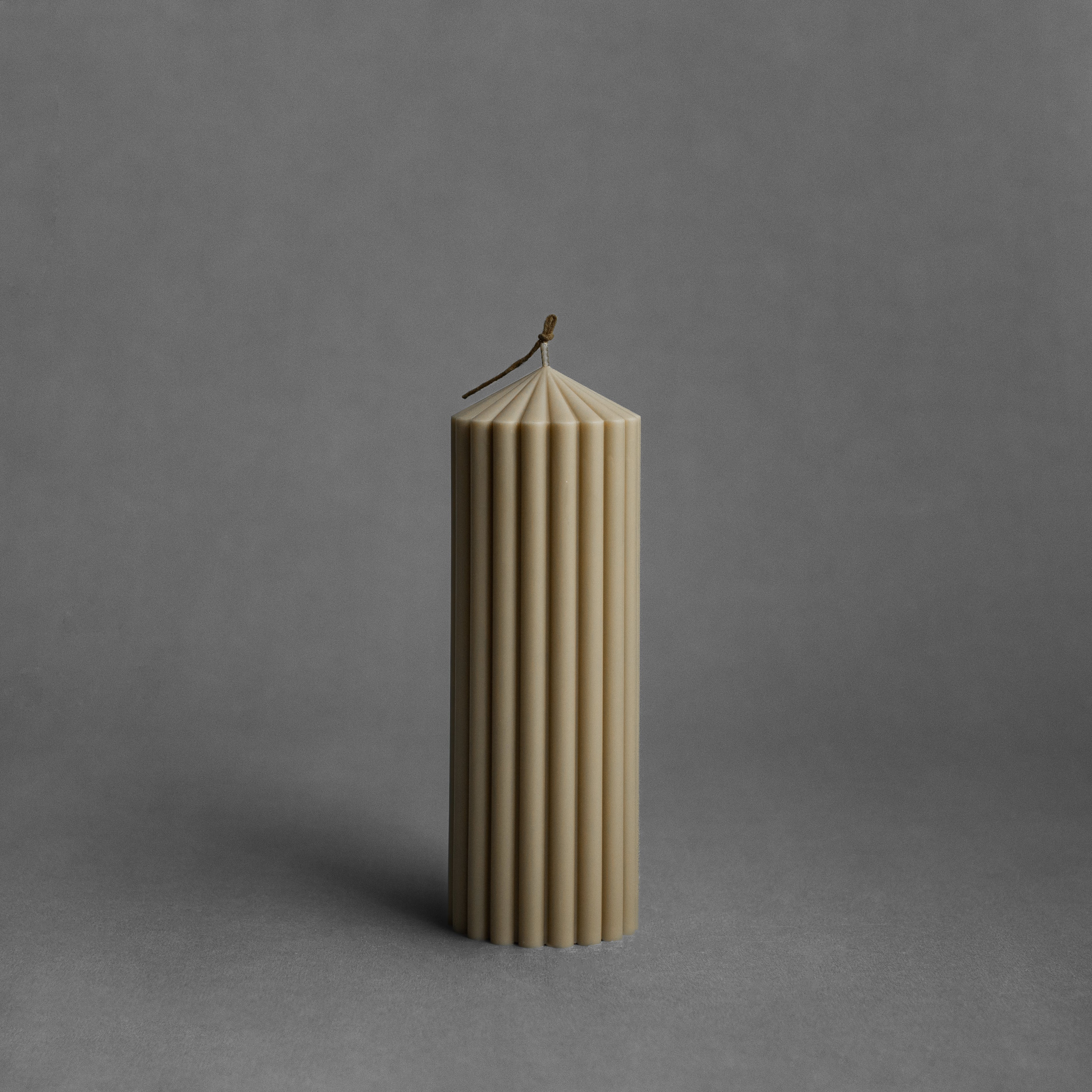 Medium olive beige peak pillar candle by LAWA featuring a tall sculptural peak shape