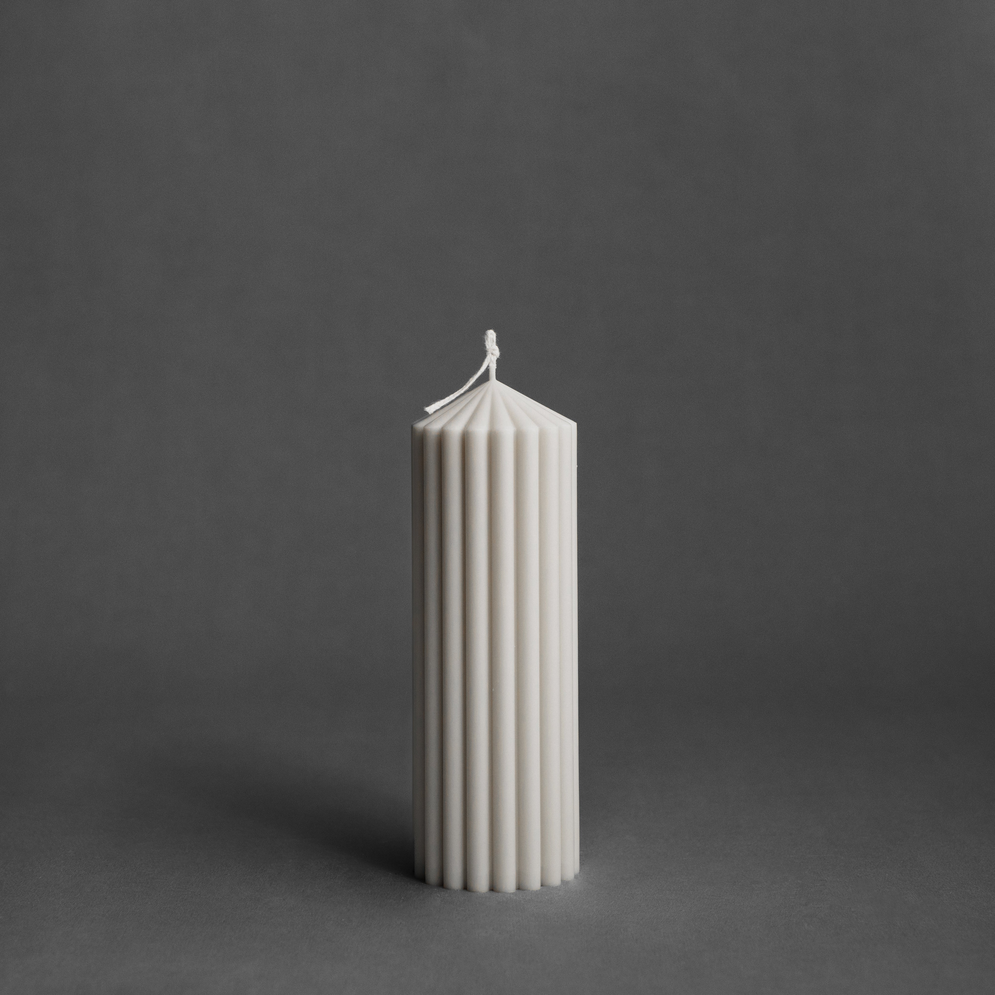 Medium white peak pillar candle by LAWA designed with modern pointed peak form