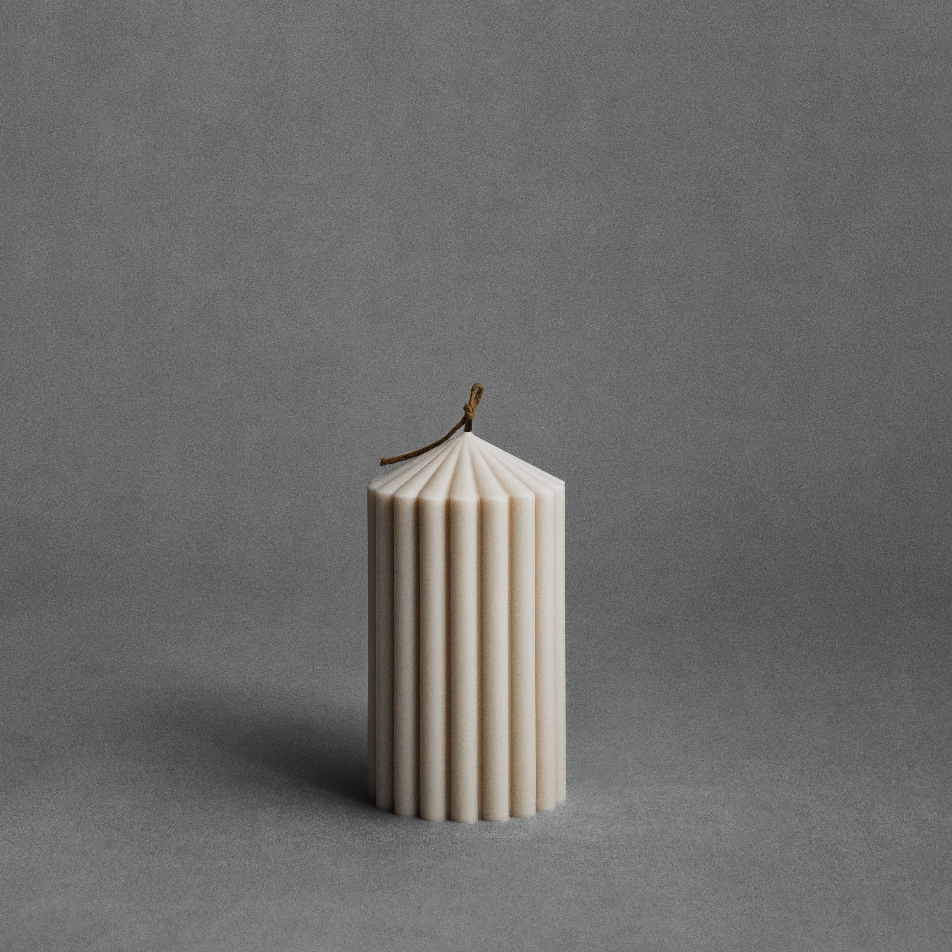 Small moon gray peak pillar candle by LAWA with sculptural pointed top