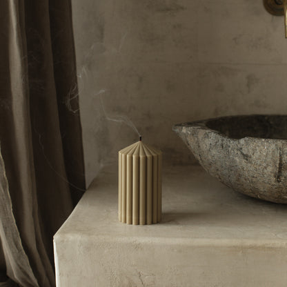 Close-up detail of handmade Peak sculptural candle showing textured soy wax surface and natural cotton wick