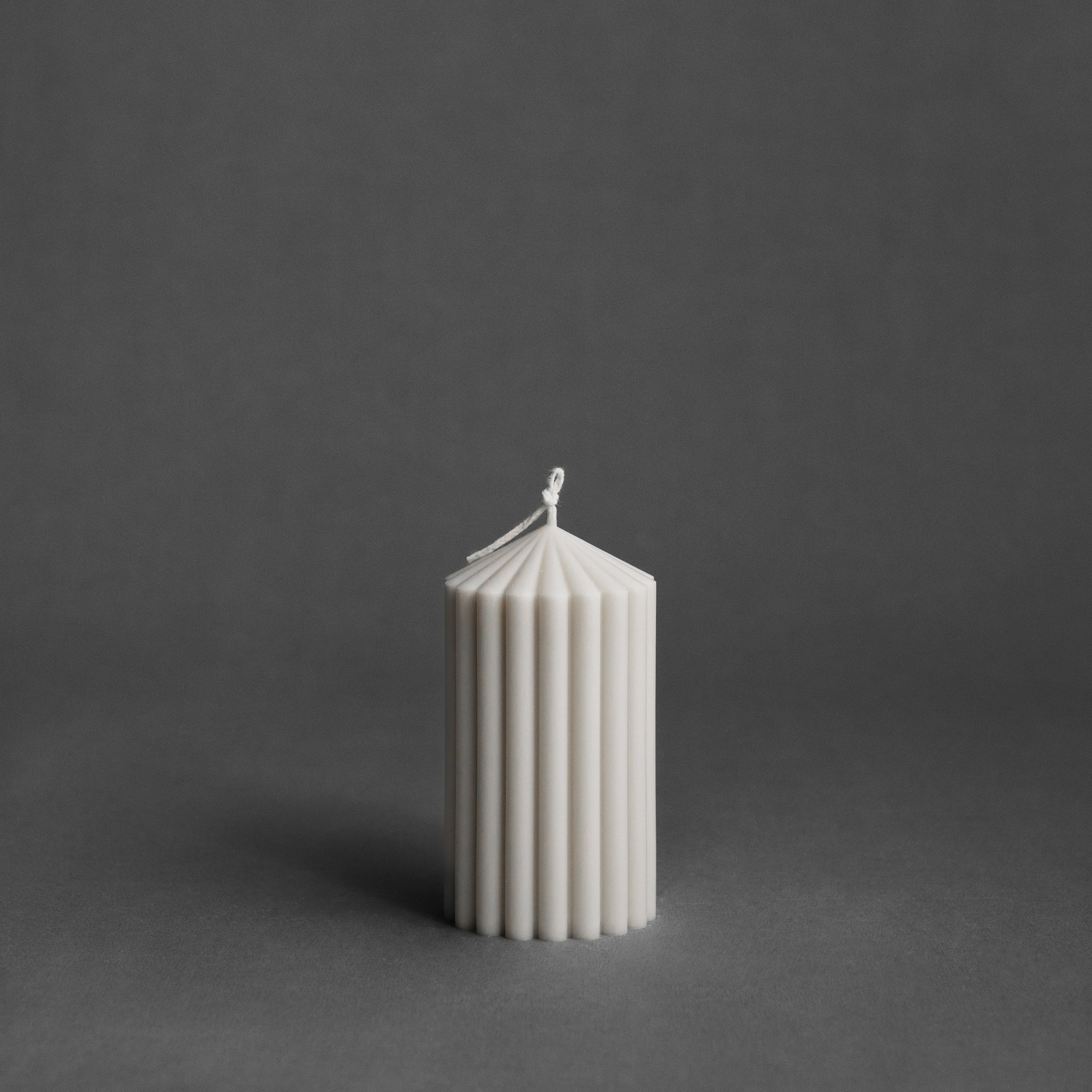 Small white peak pillar candle by LAWA with sculptural mountain-inspired shape