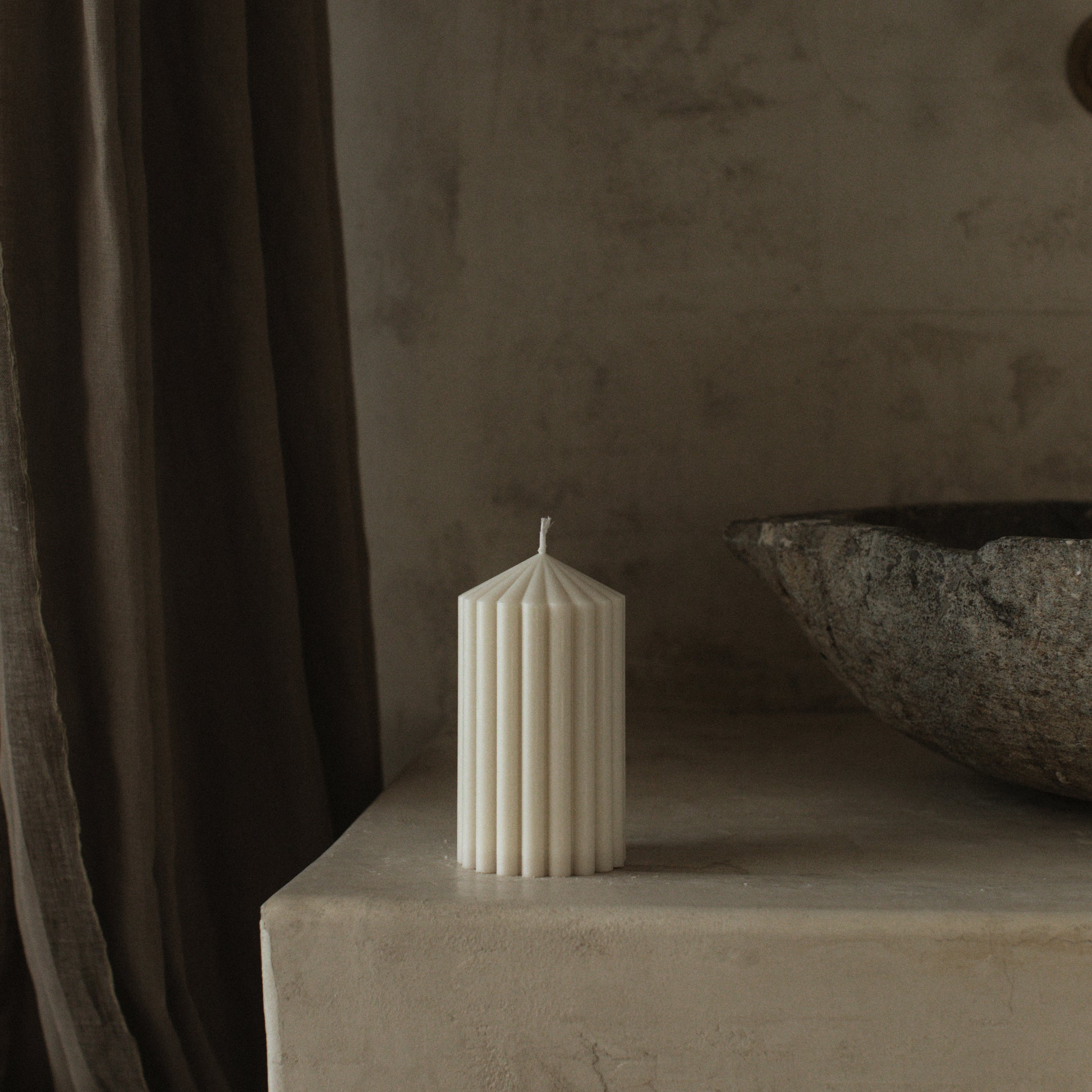 Peak sculptural candle handmade from soy wax displayed in minimalist Los Angeles interior setting