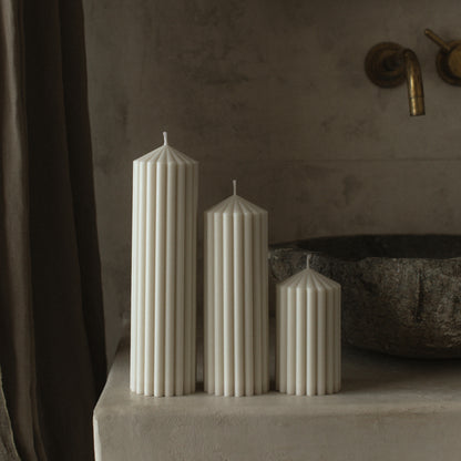 Detail view of handmade Peak sculptural candle showing smooth soy wax texture and cotton wick from Los Angeles