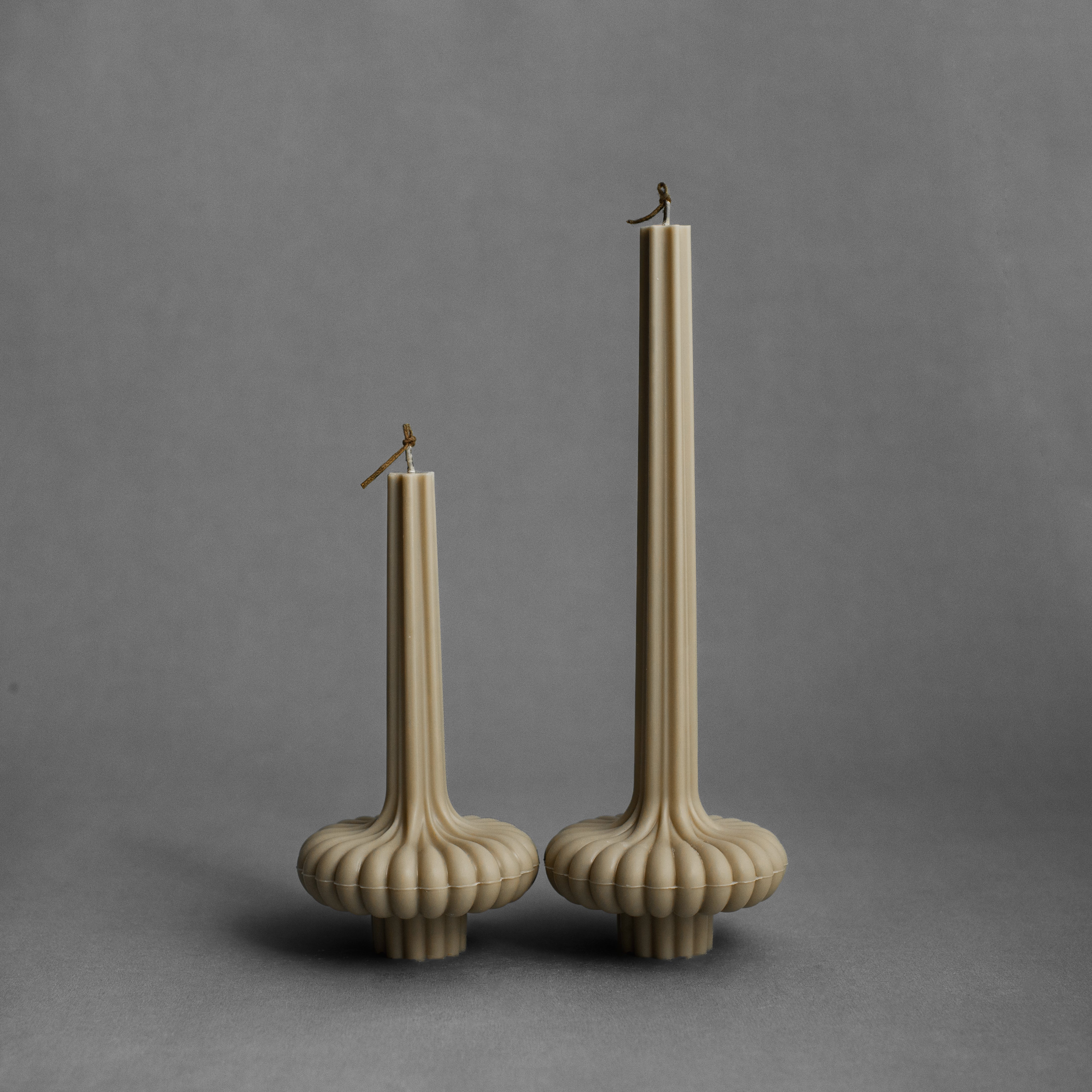 Olive beige pumpkin base pillar candle by LAWA with an earthy sculptural look