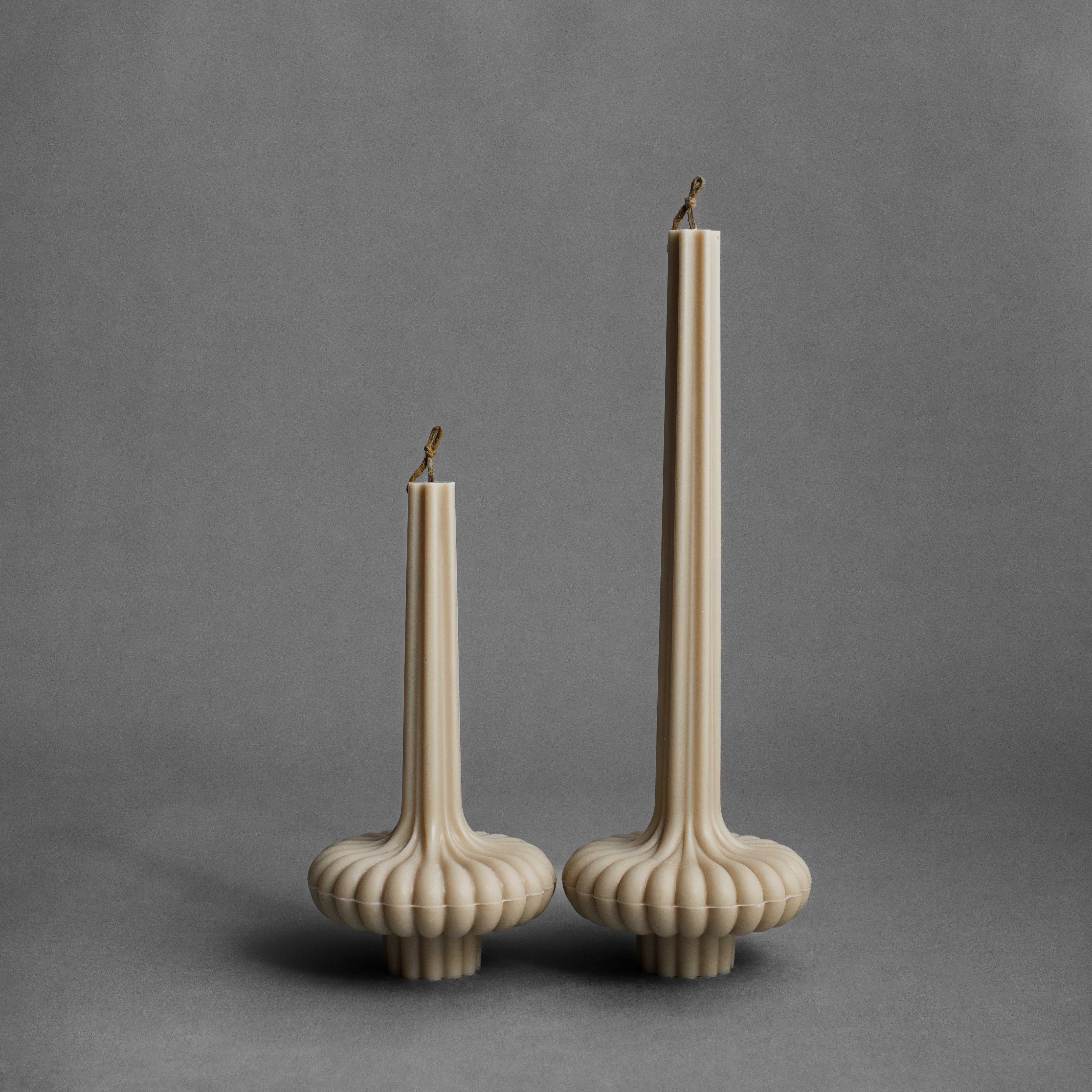 Sandstone pumpkin base pillar candle by LAWA with warm neutral tones