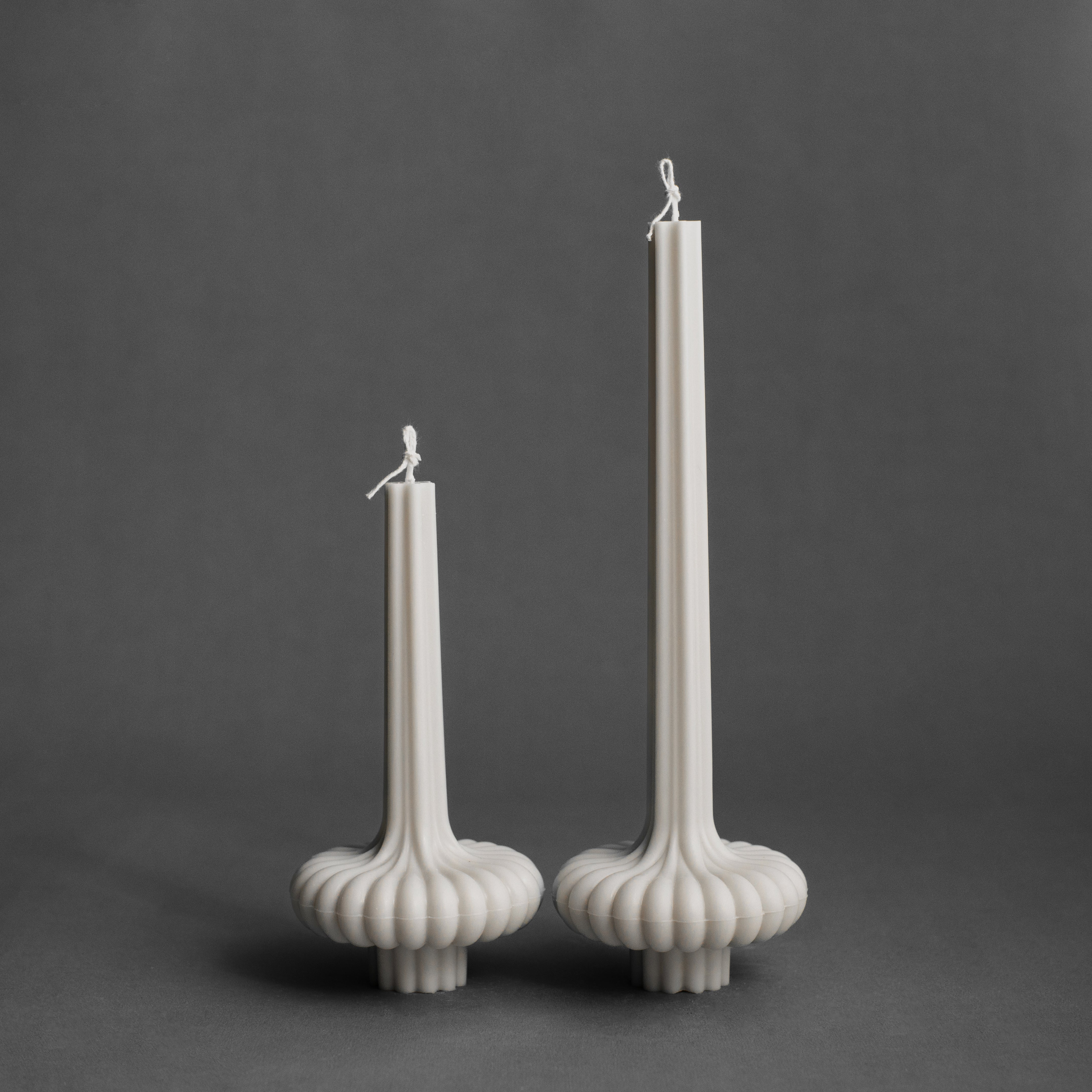 White pumpkin base pillar candle by LAWA with a rounded sculptural bottom