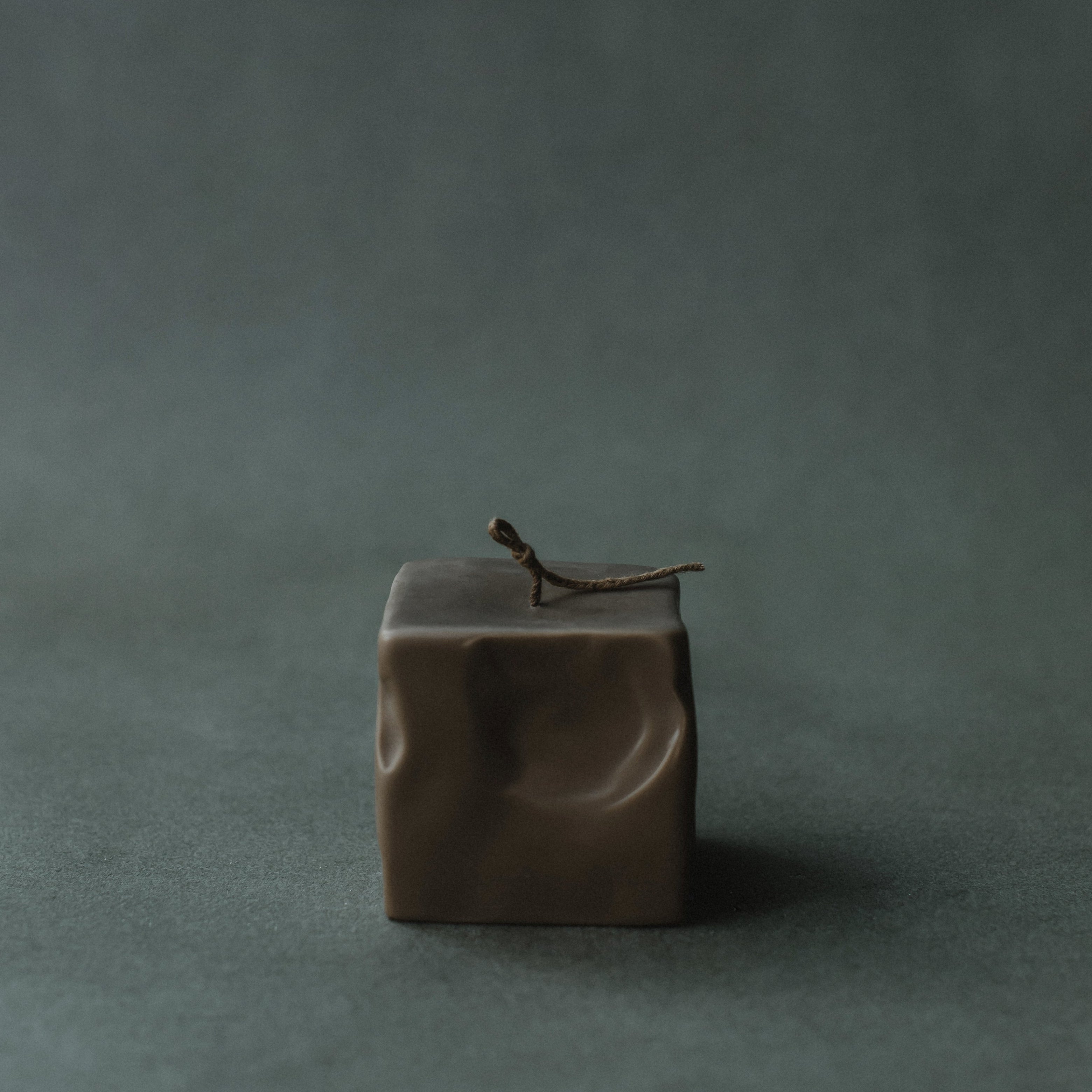 Small kobicha raw block candle by LAWA with warm brown sculptural pillar design