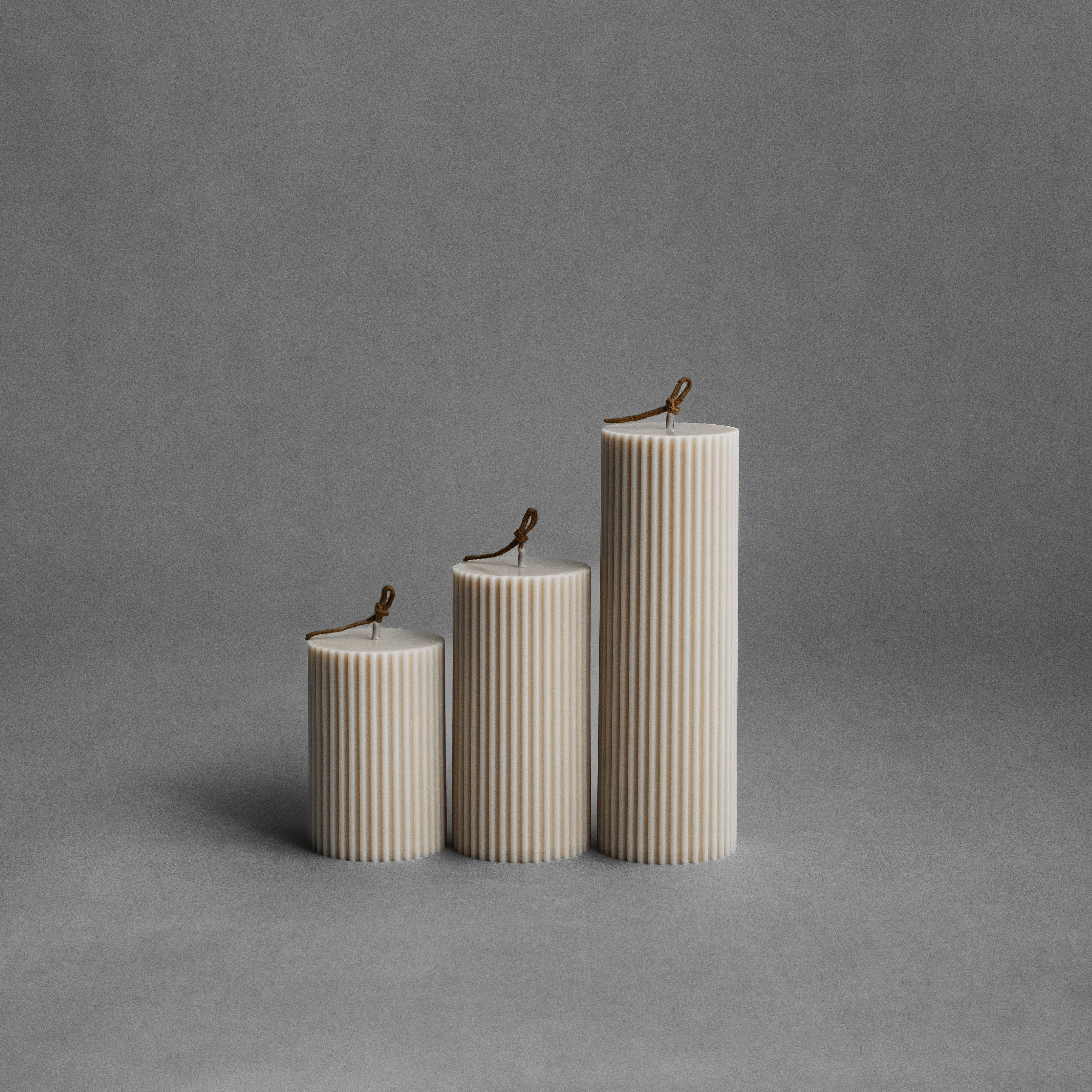 Moon gray ribbed pillar candle set by LAWA with soft sculptural vertical texture