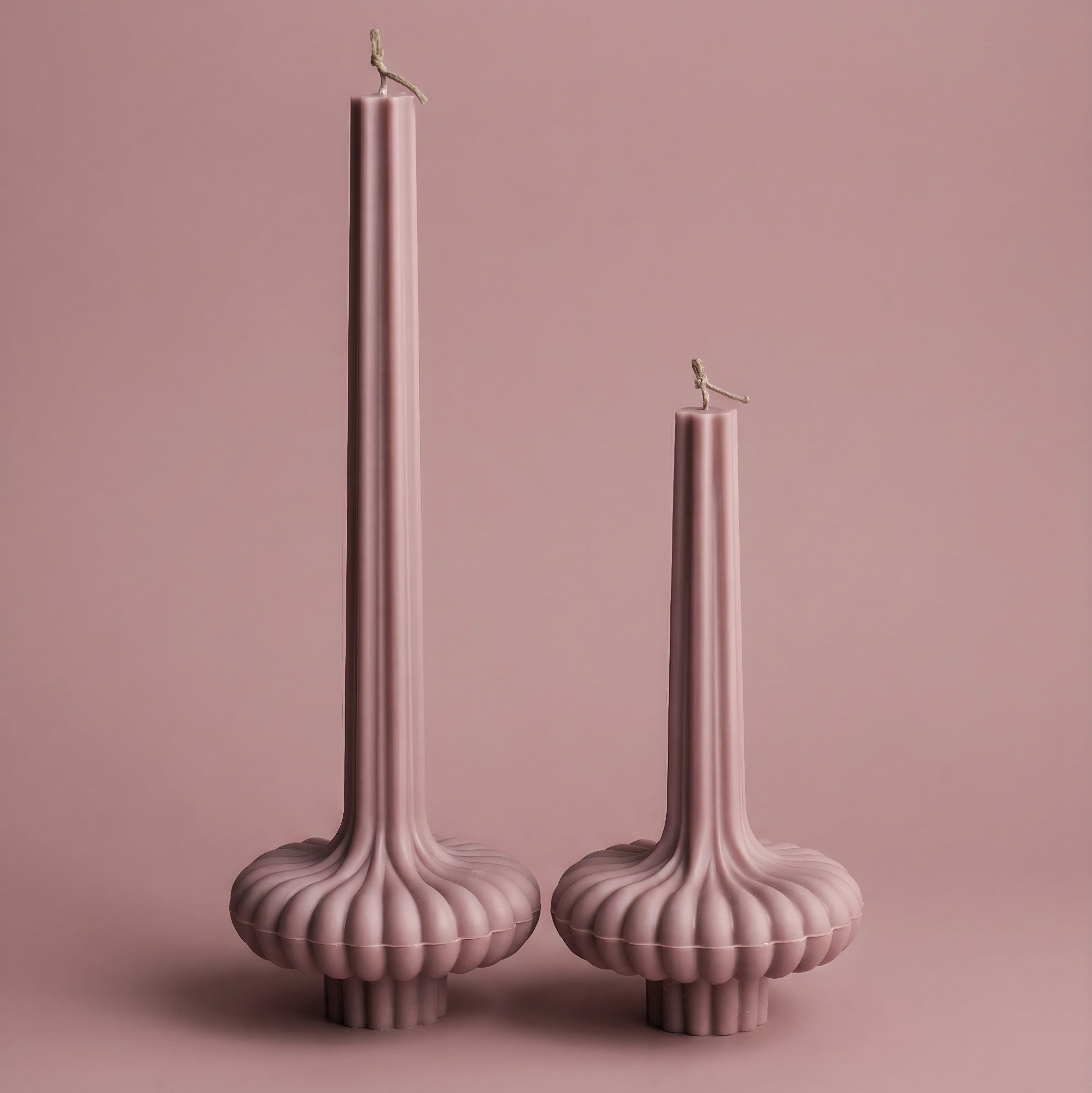 Close-up detail of handmade pumpkin sculptural candle showing textured soy wax surface and organic ridges