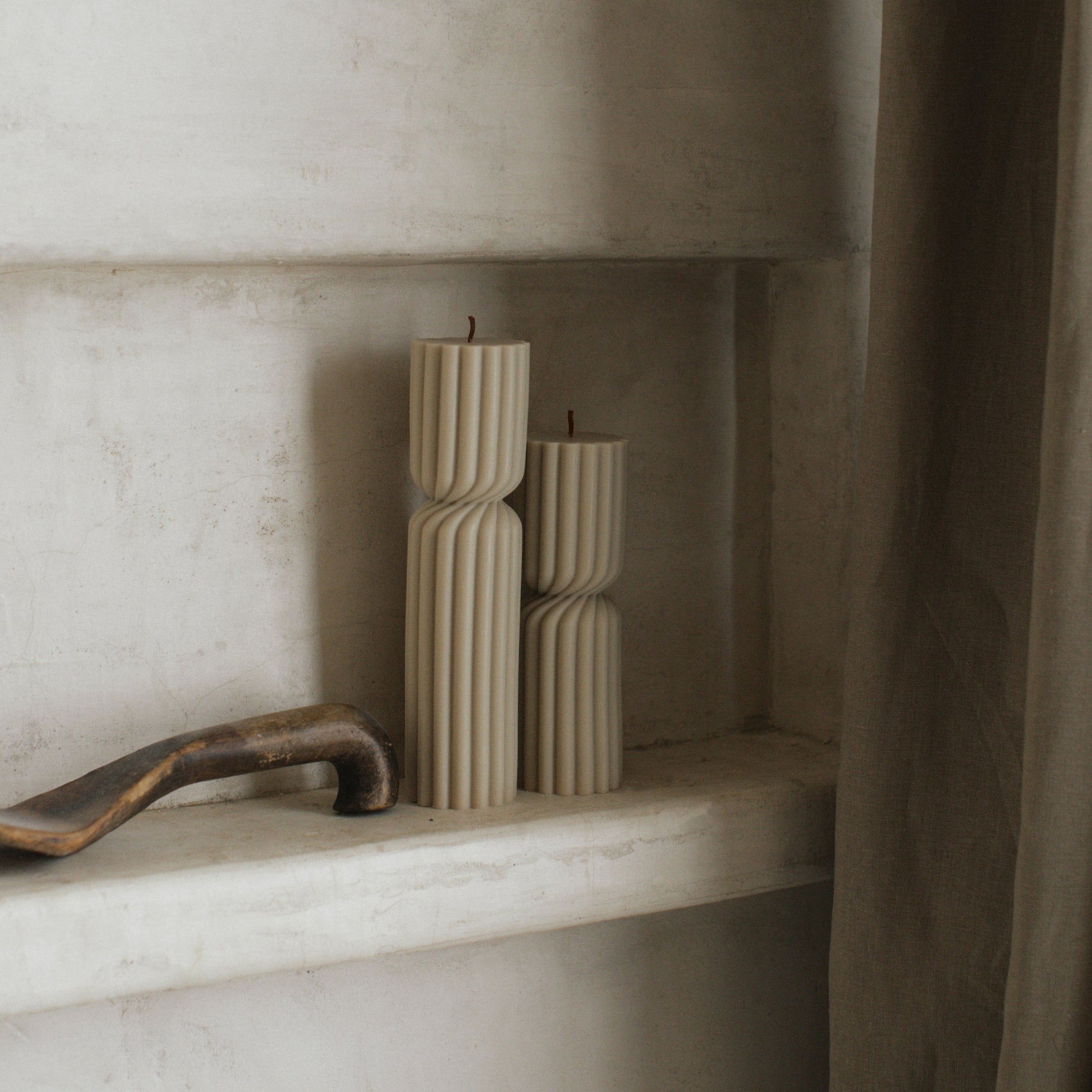 Close-up detail of handmade Spiral Spire sculptural candle showing textured soy wax surface and cotton wick