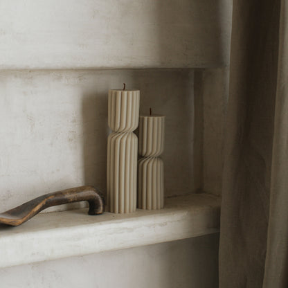 Close-up detail of handmade Spiral Spire sculptural candle showing textured soy wax surface and cotton wick