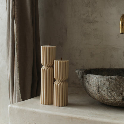 Close-up detail of handmade Spiral Spire sculptural candle showing textured soy wax surface and twisted design