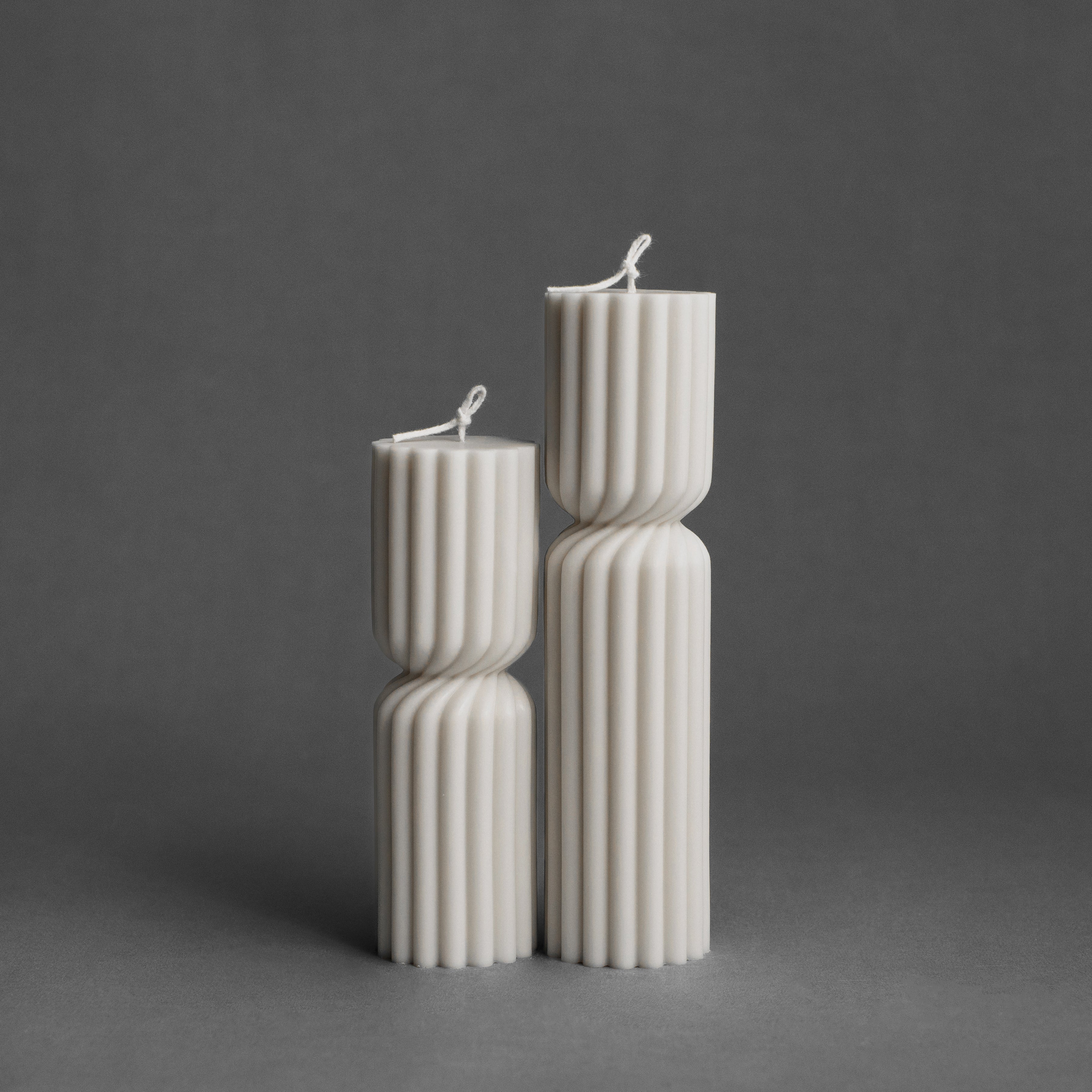 White spiral spire pillar candle set by LAWA featuring elegant twisted sculptural design