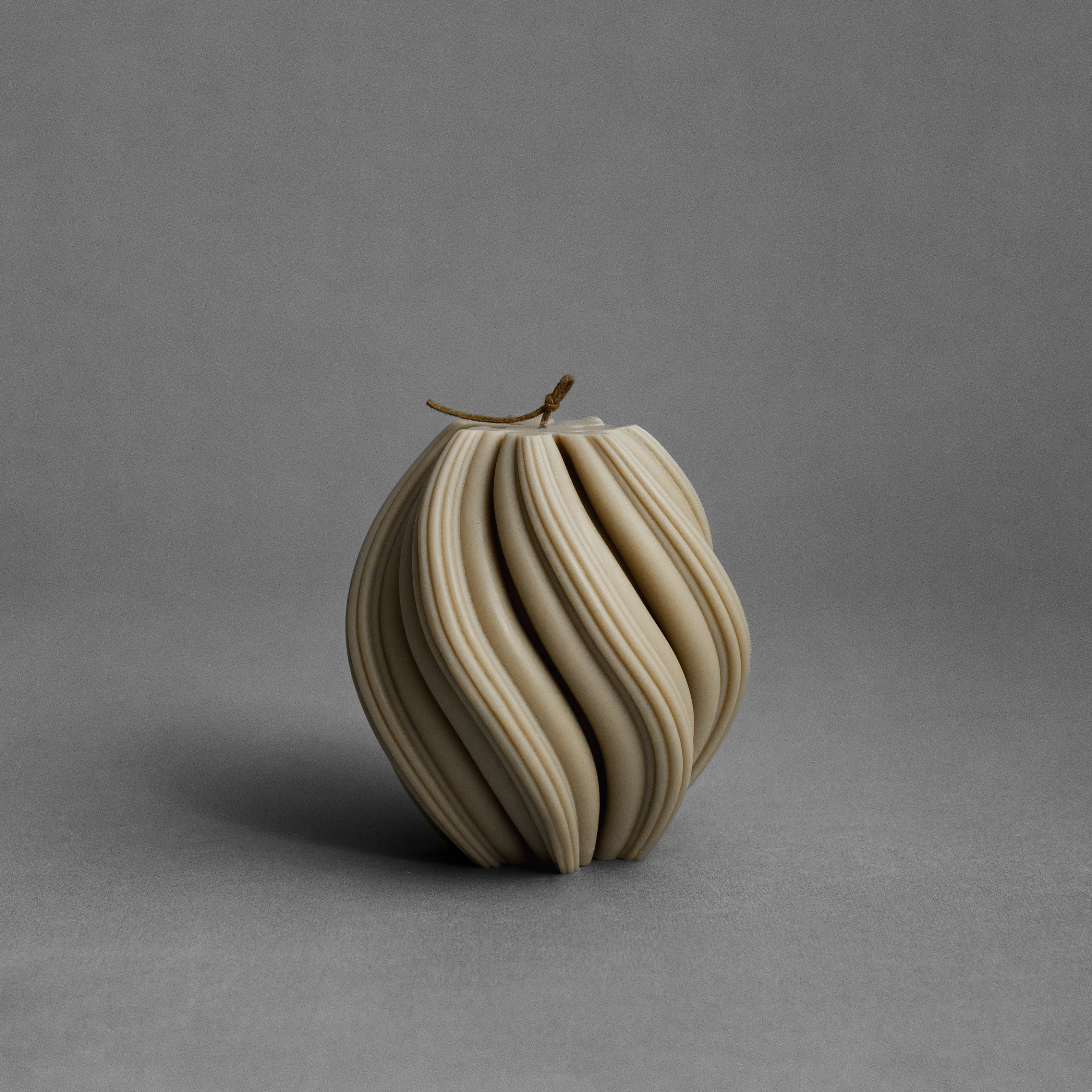 Medium olive beige swirl pillar candle by LAWA featuring elegant spiraling form