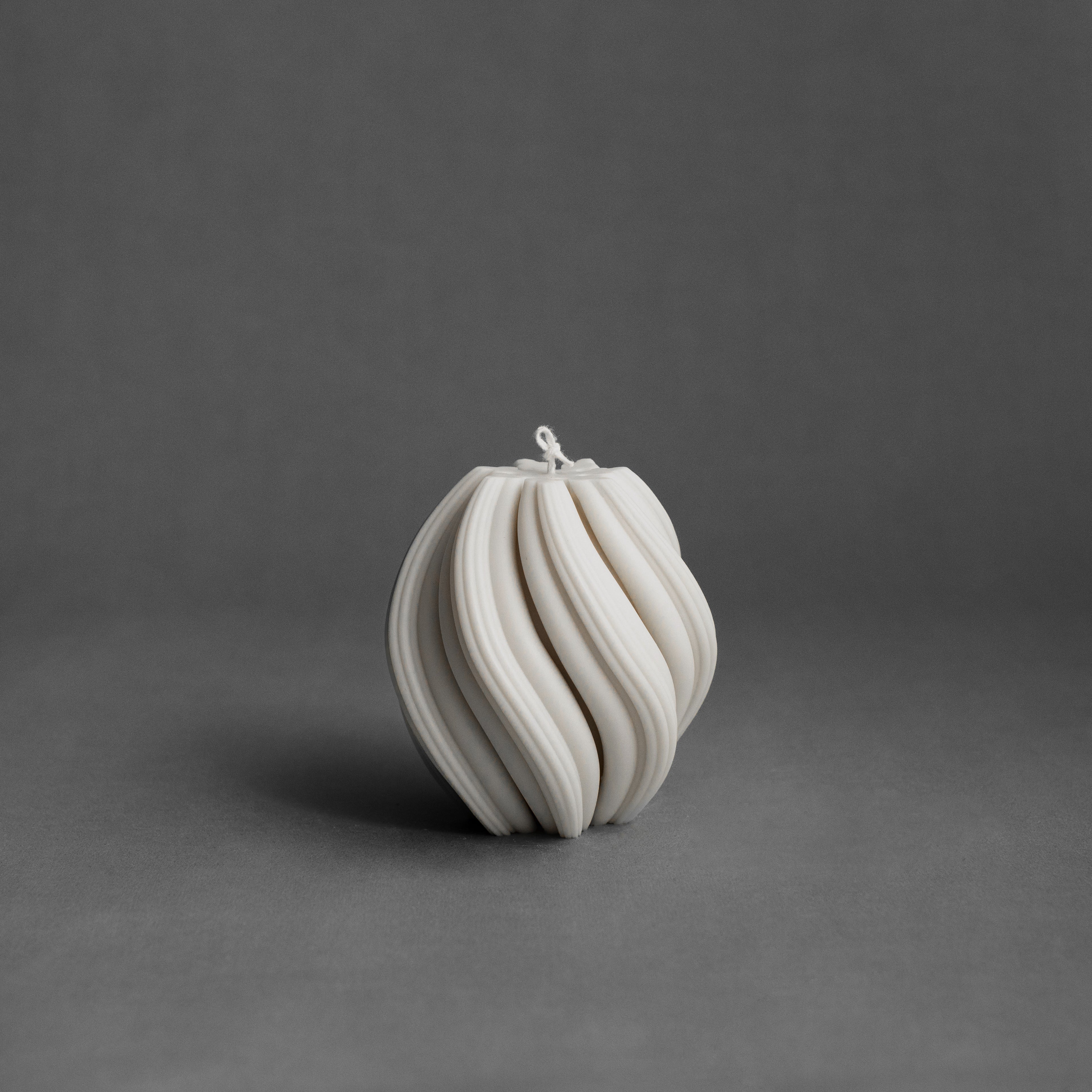 Medium white swirl pillar candle by LAWA with elegant spiraling sculptural form