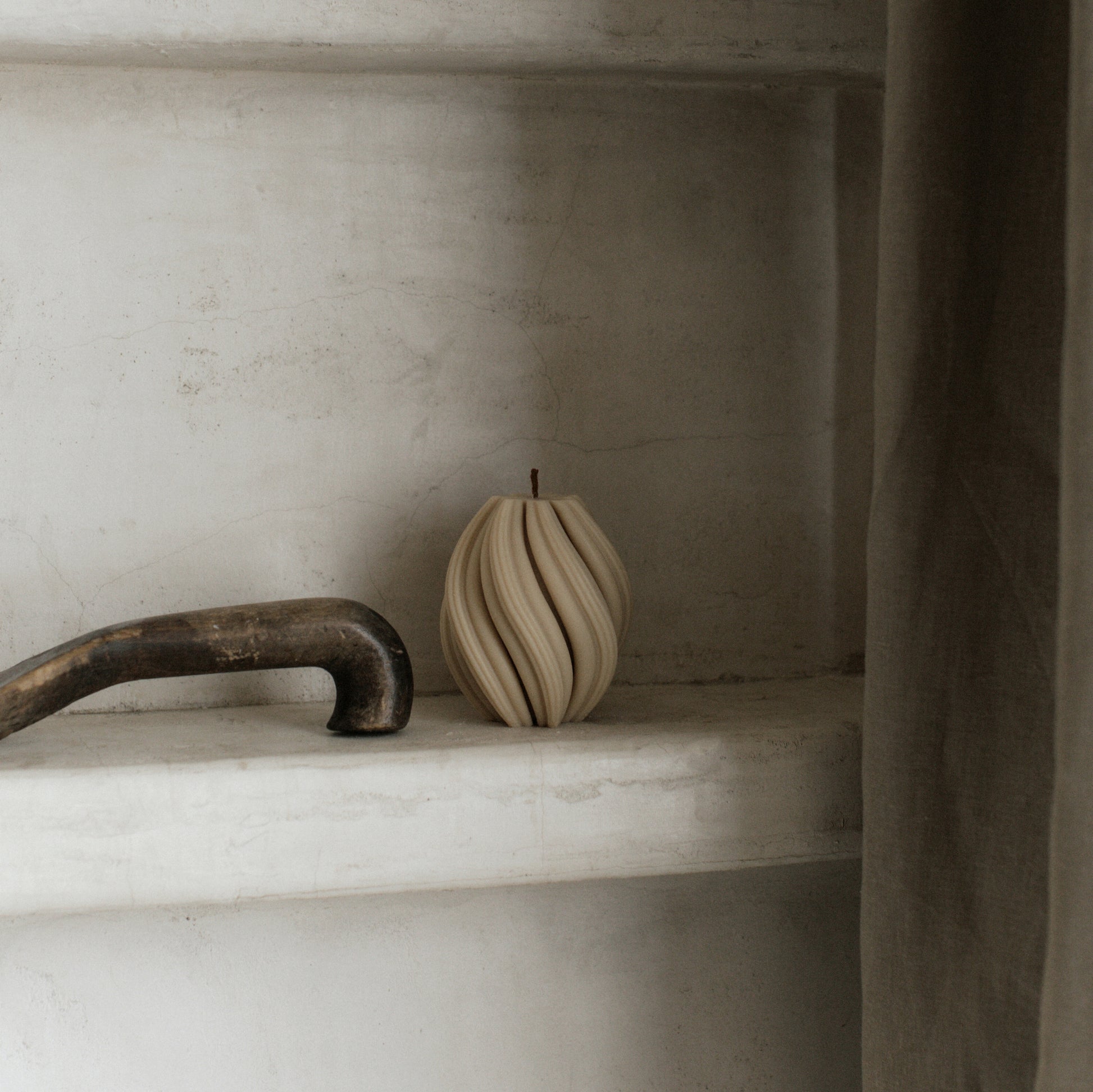 Handmade unscented soy wax swirl sculptural candle detail showing organic curved texture and artisan craftsmanship