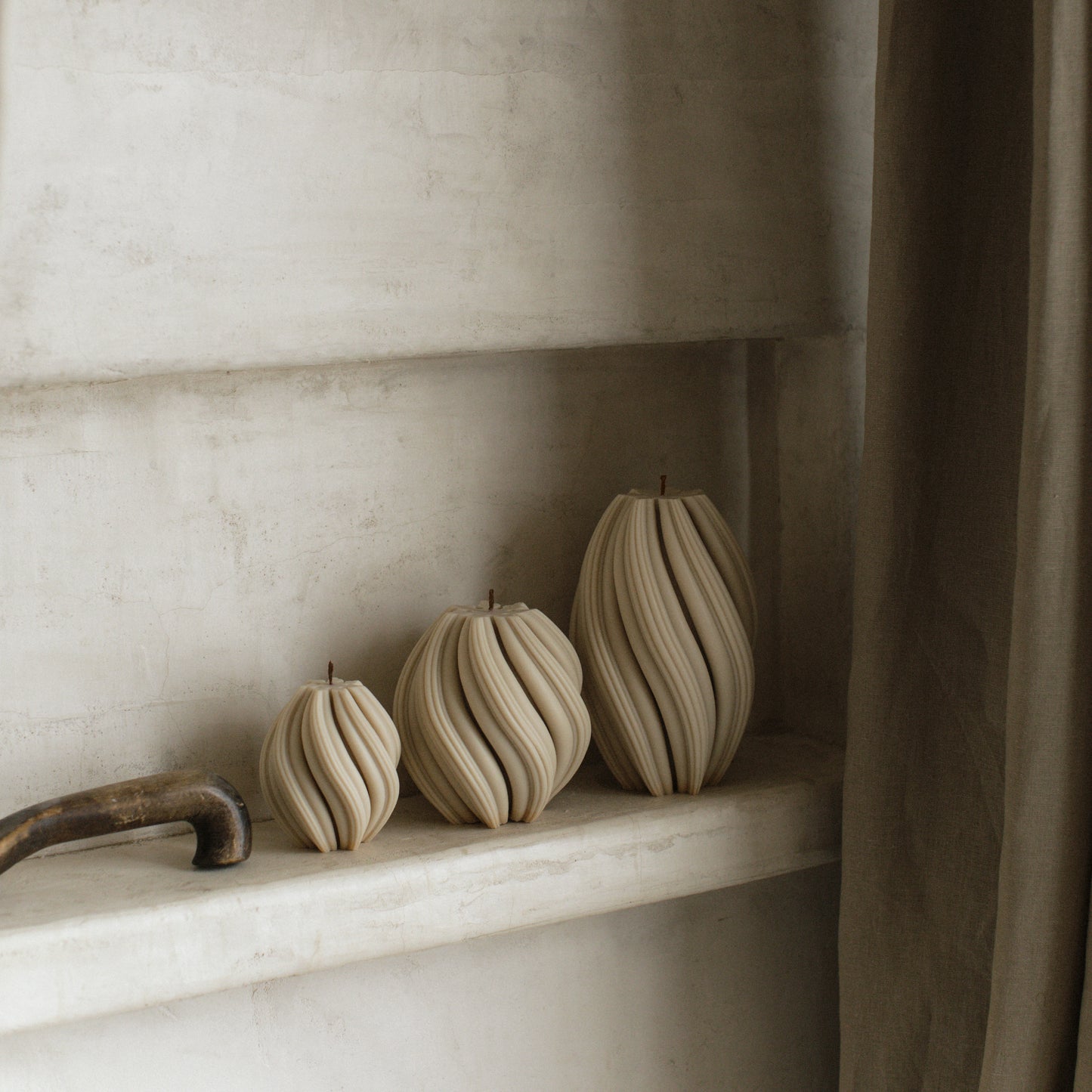 Close-up detail of handmade sculptural candle with swirled texture made from premium soy wax in Los Angeles