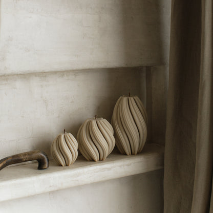 Close-up detail of handmade sculptural candle with swirled texture made from premium soy wax in Los Angeles