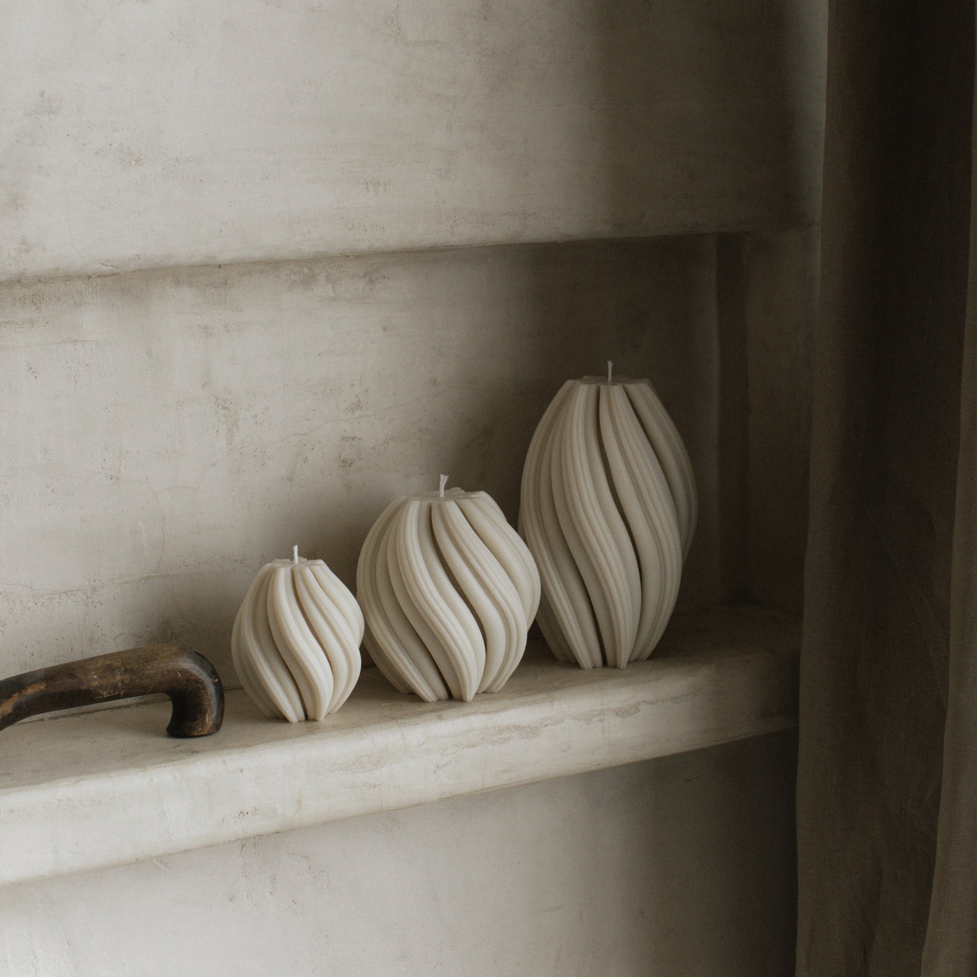 Handmade unscented swirl sculptural candle detail showing smooth soy wax texture and elegant curves in natural light