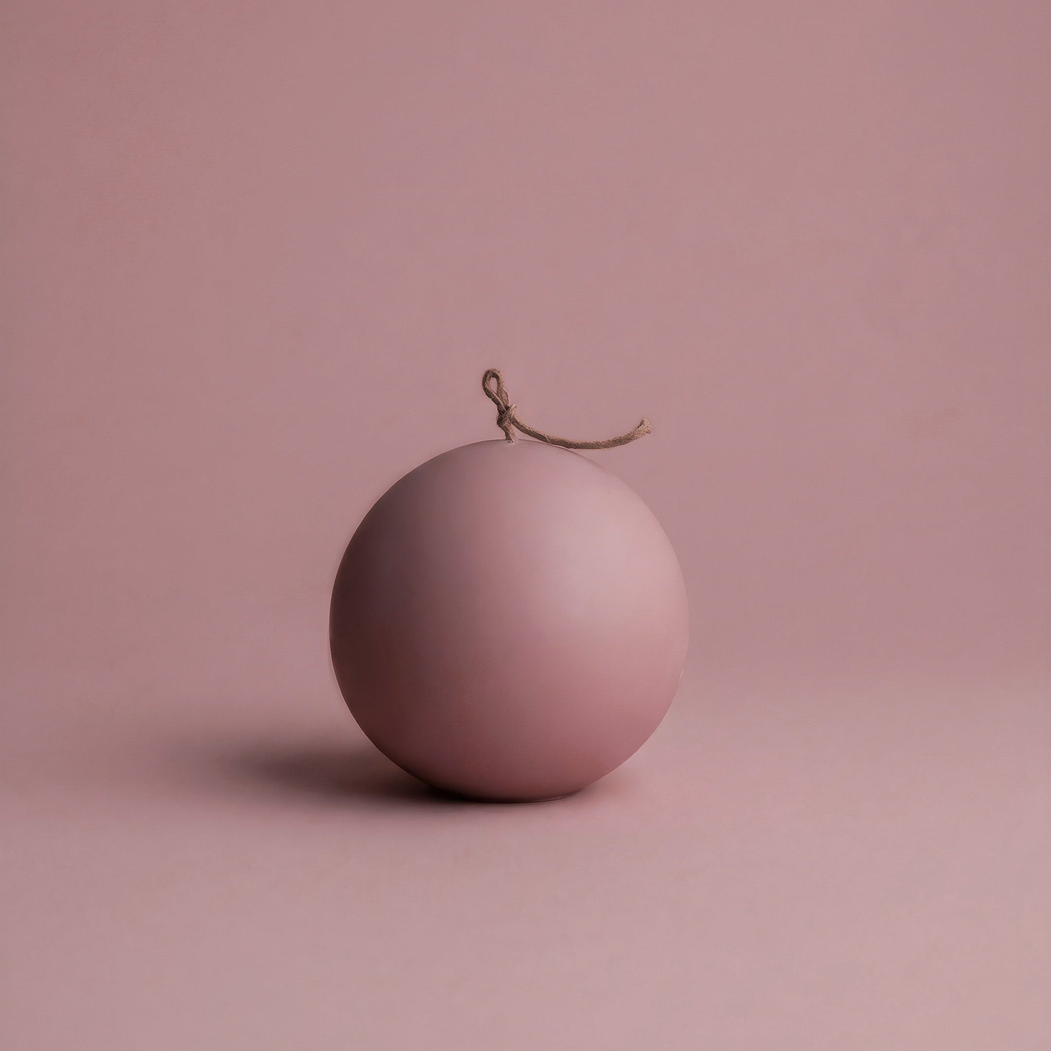 Handmade unscented sphere candle detail showing smooth soy wax texture and natural cotton wick in Los Angeles studio