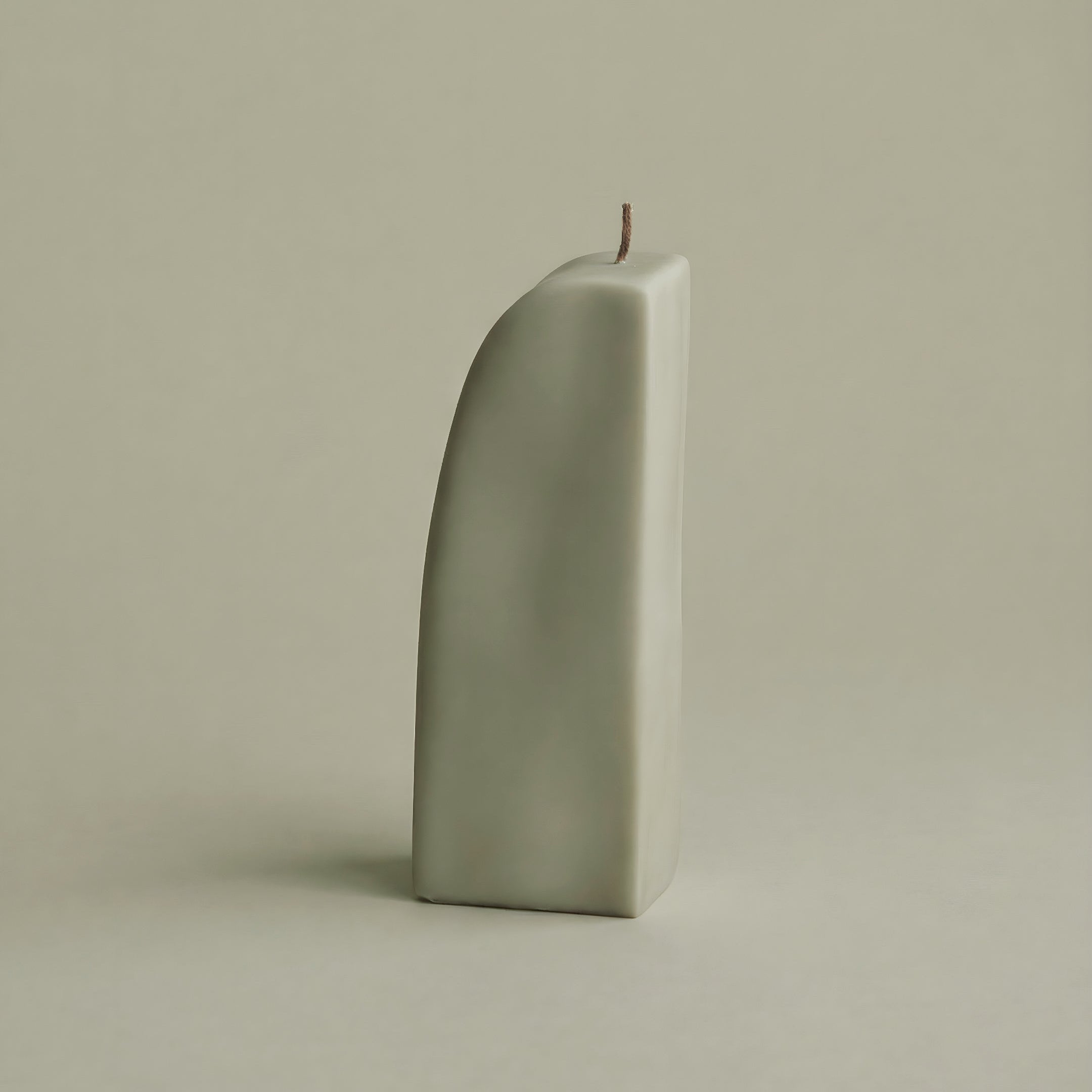 Close-up detail of handmade Downhill sculptural candle showing premium soy wax texture and cotton wick